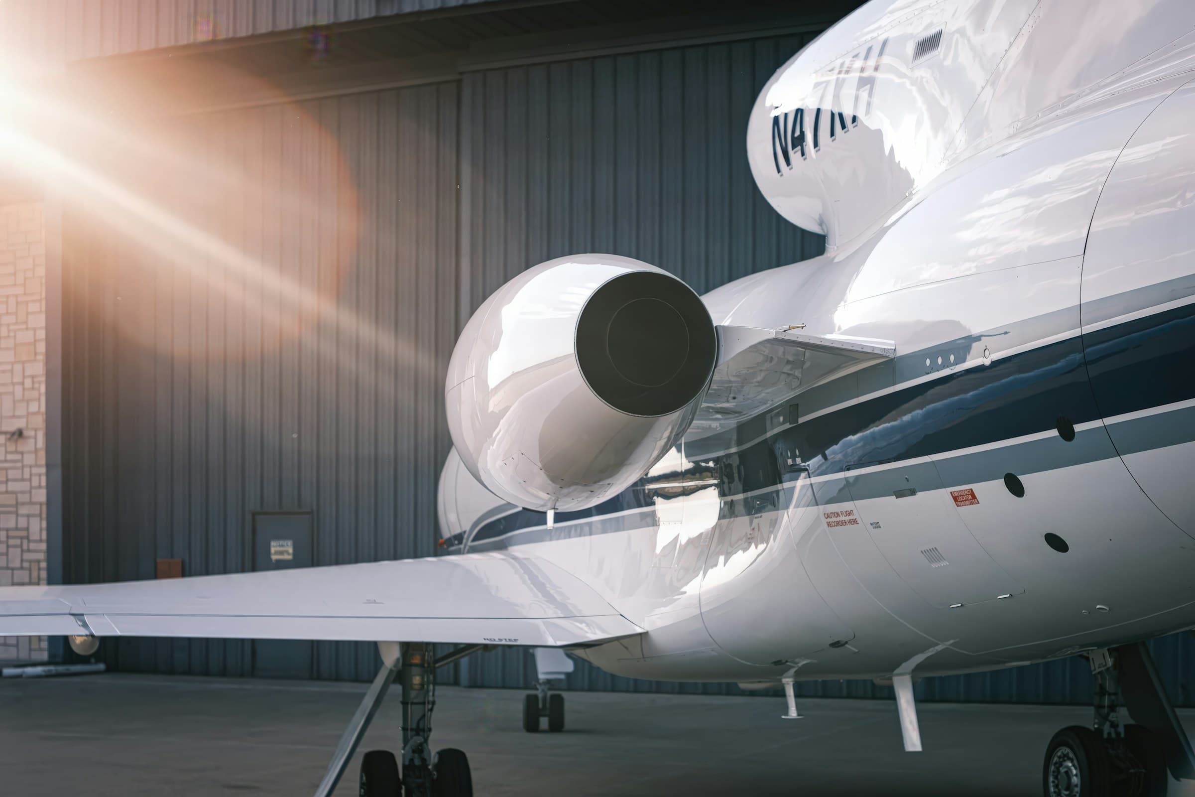 A private jet in a hangar at golden hour